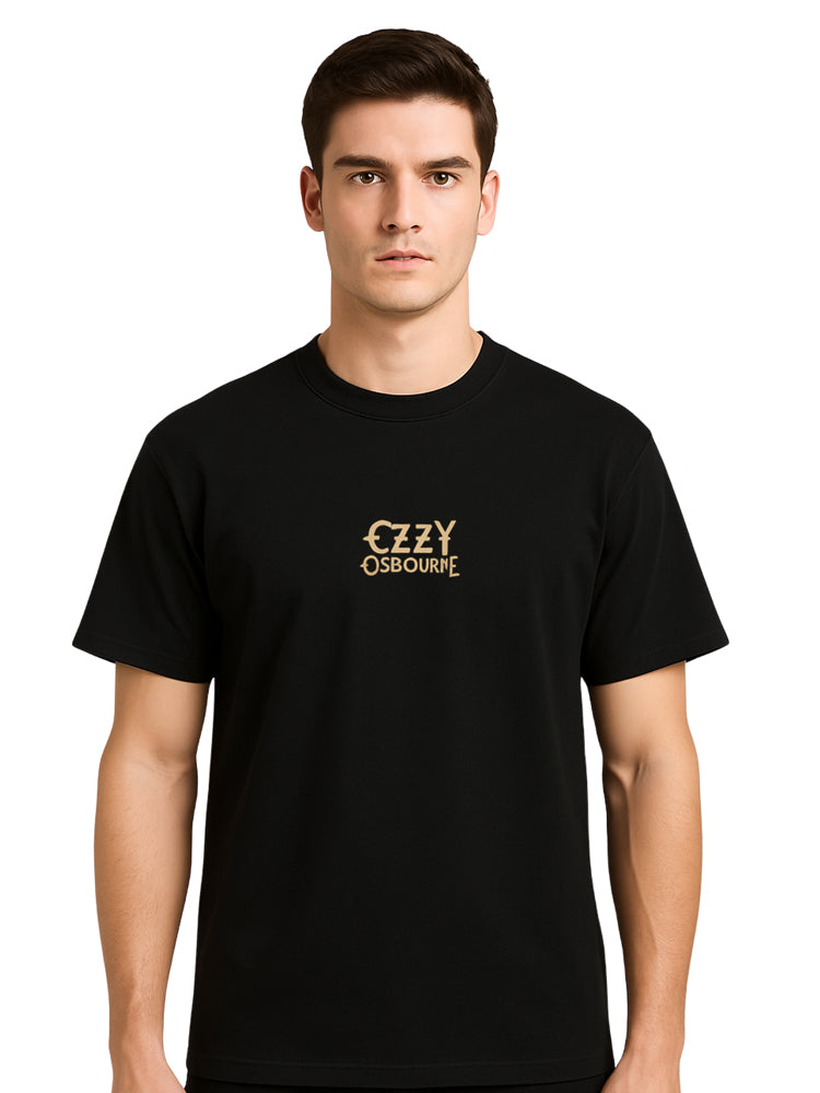 Male model wearing Ozzy Osbourne T-shirt styled with jeans and boots