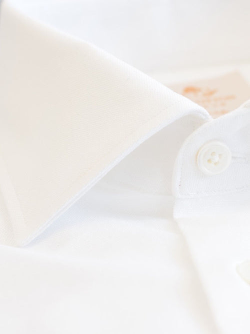 Formal Semi-cutaway collar Luxurious white shirt made with Albini Royal Oxford. Crafted in superfine cotton, slim fitted with semi-cutaway collar, full sleeves & French cuffs, MOP buttons
