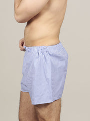 Side view of model wearing striped boxers in muave