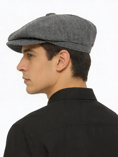 Grey herringbone baker boy cap shown from the back
