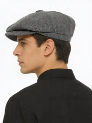 Grey herringbone baker boy cap shown from the back