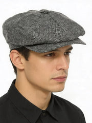 Grey herringbone baker boy cap side view