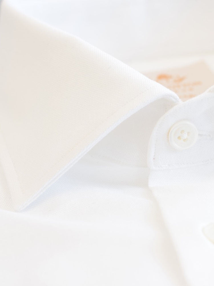 Formal Semi-cutaway collar Luxurious white shirt made with Albini Royal Oxford. Crafted in superfine cotton, slim fitted with semi-cutaway collar, full sleeves & French cuffs, MOP buttons