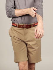 Model wearing canvas belt with chino shorts