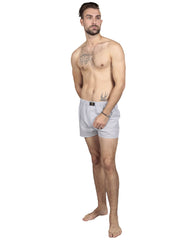 Model wearing striped cotton boxers in grey